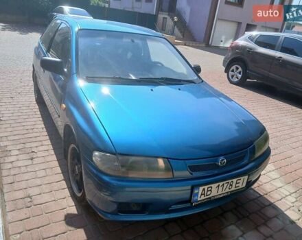 Синий Мазда 323, объемом двигателя 1.5 л и пробегом 332 тыс. км за 3000 $, фото 1 на Automoto.ua