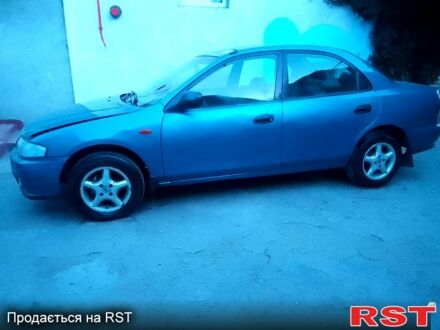 Синий Мазда 323, объемом двигателя 1.5 л и пробегом 257 тыс. км за 950 $, фото 1 на Automoto.ua