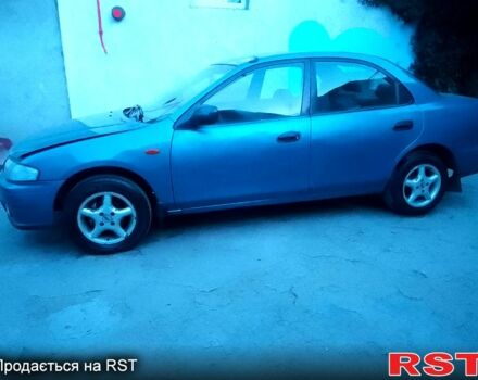 Синій Мазда 323, об'ємом двигуна 1.5 л та пробігом 257 тис. км за 950 $, фото 1 на Automoto.ua