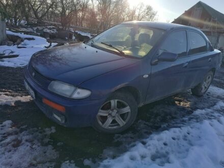 Синий Мазда 323, объемом двигателя 1.8 л и пробегом 300 тыс. км за 1000 $, фото 1 на Automoto.ua