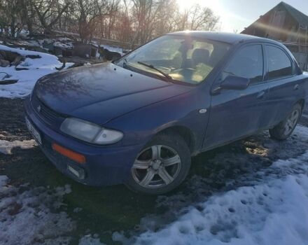 Синий Мазда 323, объемом двигателя 1.8 л и пробегом 300 тыс. км за 1000 $, фото 1 на Automoto.ua