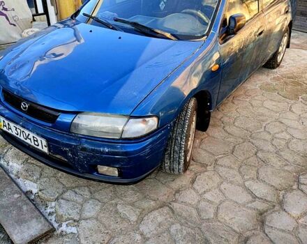 Синій Мазда 323, об'ємом двигуна 1.5 л та пробігом 168 тис. км за 1550 $, фото 1 на Automoto.ua