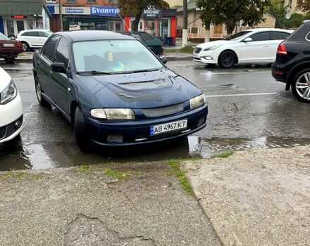 Синий Мазда 323, объемом двигателя 1.5 л и пробегом 320 тыс. км за 1300 $, фото 1 на Automoto.ua