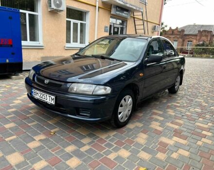 Синій Мазда 323, об'ємом двигуна 1.5 л та пробігом 1 тис. км за 1203 $, фото 1 на Automoto.ua