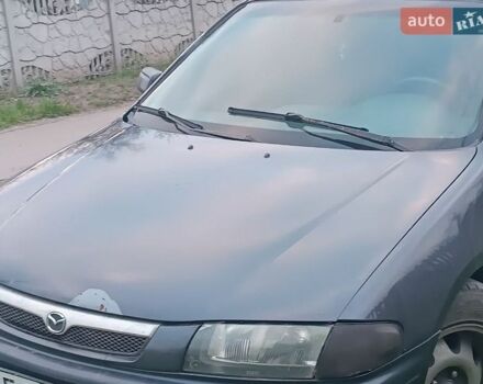 Синий Мазда 323, объемом двигателя 1.8 л и пробегом 440 тыс. км за 1300 $, фото 1 на Automoto.ua