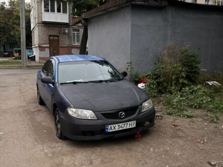 Синий Мазда 323, объемом двигателя 1.8 л и пробегом 255 тыс. км за 897 $, фото 1 на Automoto.ua