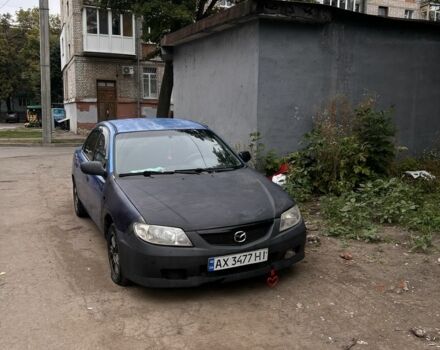 Синій Мазда 323, об'ємом двигуна 1.8 л та пробігом 255 тис. км за 897 $, фото 1 на Automoto.ua