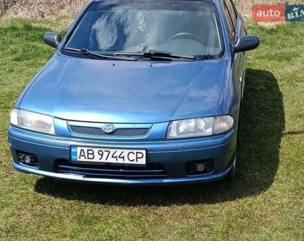 Синий Мазда 323, объемом двигателя 1.5 л и пробегом 312 тыс. км за 2200 $, фото 1 на Automoto.ua