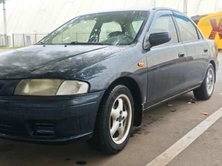 Синий Мазда 323, объемом двигателя 1.5 л и пробегом 420 тыс. км за 1300 $, фото 1 на Automoto.ua