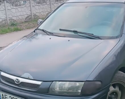 Синий Мазда 323, объемом двигателя 1.8 л и пробегом 450 тыс. км за 1700 $, фото 1 на Automoto.ua