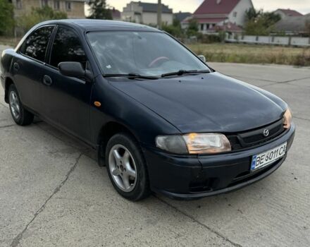 Синий Мазда 323, объемом двигателя 1.5 л и пробегом 200 тыс. км за 1350 $, фото 1 на Automoto.ua