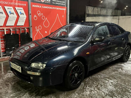 Синій Мазда 323, об'ємом двигуна 1.49 л та пробігом 343 тис. км за 2100 $, фото 1 на Automoto.ua