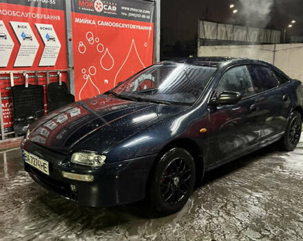 Синий Мазда 323, объемом двигателя 1.49 л и пробегом 343 тыс. км за 2100 $, фото 1 на Automoto.ua