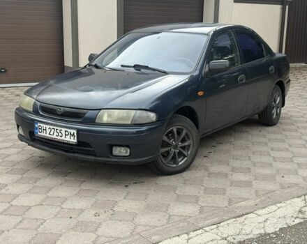 Синий Мазда 323, объемом двигателя 1.5 л и пробегом 444 тыс. км за 1375 $, фото 1 на Automoto.ua