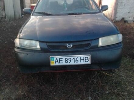 Синий Мазда 323, объемом двигателя 1.5 л и пробегом 387 тыс. км за 1354 $, фото 1 на Automoto.ua