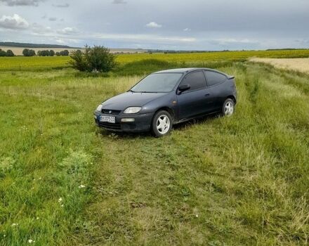 Синий Мазда 323, объемом двигателя 1.5 л и пробегом 325 тыс. км за 1050 $, фото 1 на Automoto.ua