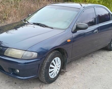 Синий Мазда 323, объемом двигателя 1.5 л и пробегом 74 тыс. км за 1950 $, фото 1 на Automoto.ua