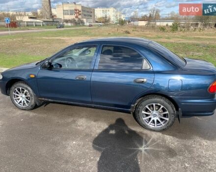Синій Мазда 323, об'ємом двигуна 1.5 л та пробігом 240 тис. км за 2700 $, фото 1 на Automoto.ua