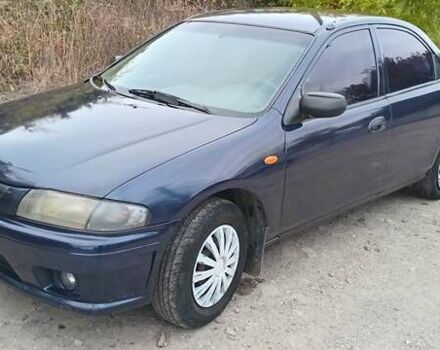 Синий Мазда 323, объемом двигателя 1.5 л и пробегом 70 тыс. км за 1950 $, фото 1 на Automoto.ua