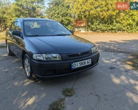 Синий Мазда 323, объемом двигателя 1.5 л и пробегом 202 тыс. км за 2800 $, фото 1 на Automoto.ua