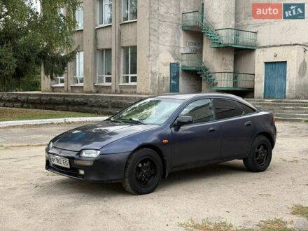 Синий Мазда 323, объемом двигателя 1.49 л и пробегом 450 тыс. км за 1000 $, фото 1 на Automoto.ua