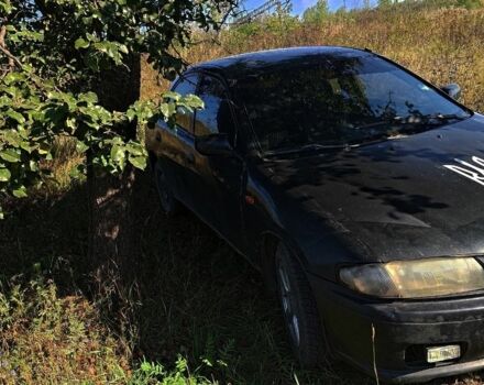 Синий Мазда 323, объемом двигателя 1 л и пробегом 245 тыс. км за 1083 $, фото 1 на Automoto.ua