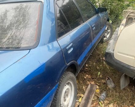 Синий Мазда 323, объемом двигателя 2 л и пробегом 100 тыс. км за 600 $, фото 1 на Automoto.ua