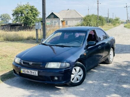 Синій Мазда 323, об'ємом двигуна 1.5 л та пробігом 200 тис. км за 2000 $, фото 1 на Automoto.ua