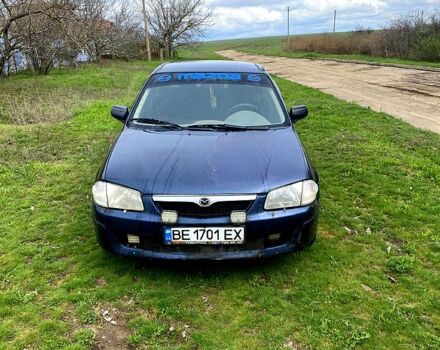 Синий Мазда 323, объемом двигателя 1.5 л и пробегом 300 тыс. км за 1500 $, фото 1 на Automoto.ua