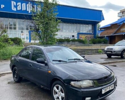 Синий Мазда 323, объемом двигателя 1.8 л и пробегом 200 тыс. км за 731 $, фото 1 на Automoto.ua