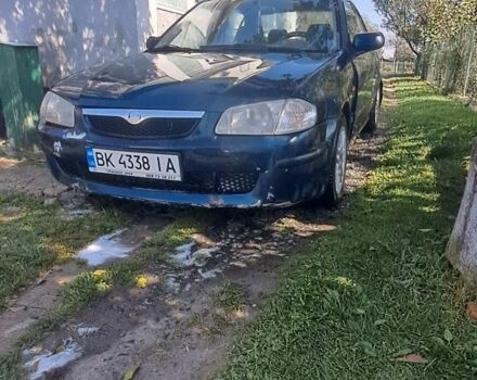 Синій Мазда 323, об'ємом двигуна 2 л та пробігом 310 тис. км за 800 $, фото 1 на Automoto.ua