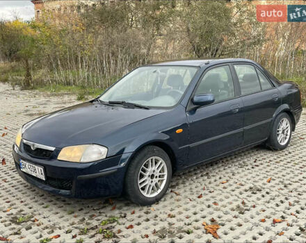 Синій Мазда 323, об'ємом двигуна 2 л та пробігом 310 тис. км за 2400 $, фото 1 на Automoto.ua