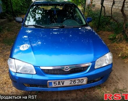 Синий Мазда 323, объемом двигателя 1.5 л и пробегом 300 тыс. км за 550 $, фото 1 на Automoto.ua