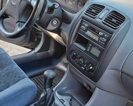 Синий Мазда 323, объемом двигателя 1.5 л и пробегом 275 тыс. км за 2300 $, фото 1 на Automoto.ua