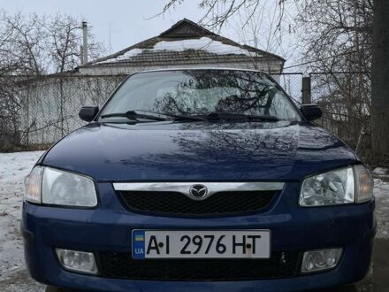 Синій Мазда 323, об'ємом двигуна 2 л та пробігом 390 тис. км за 3500 $, фото 1 на Automoto.ua