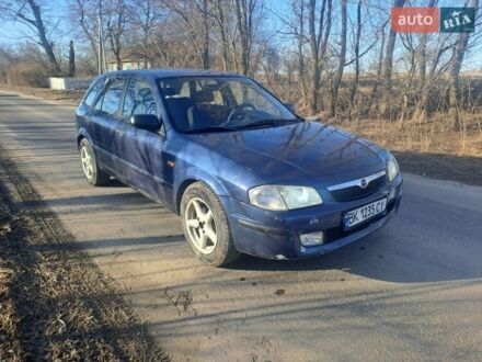 Синий Мазда 323, объемом двигателя 2 л и пробегом 229 тыс. км за 2300 $, фото 1 на Automoto.ua