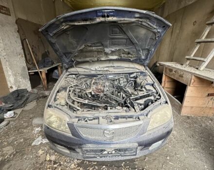 Синий Мазда 323, объемом двигателя 0 л и пробегом 200 тыс. км за 500 $, фото 1 на Automoto.ua