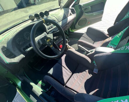 Зеленый Мазда 323, объемом двигателя 2 л и пробегом 200 тыс. км за 4200 $, фото 12 на Automoto.ua