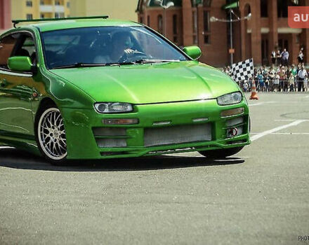 Зеленый Мазда 323, объемом двигателя 2 л и пробегом 200 тыс. км за 4200 $, фото 2 на Automoto.ua