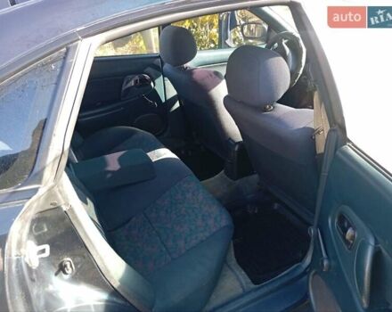 Зелений Мазда 323, об'ємом двигуна 1.49 л та пробігом 280 тис. км за 2500 $, фото 9 на Automoto.ua