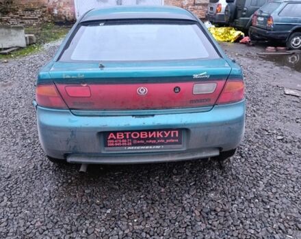 Зеленый Мазда 323, объемом двигателя 1.5 л и пробегом 300 тыс. км за 699 $, фото 2 на Automoto.ua