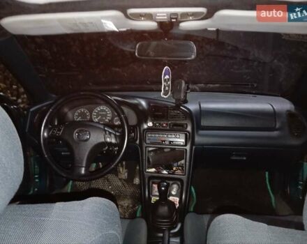 Зеленый Мазда 323, объемом двигателя 1.5 л и пробегом 350 тыс. км за 2750 $, фото 9 на Automoto.ua