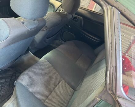 Зеленый Мазда 323, объемом двигателя 1.5 л и пробегом 451 тыс. км за 2600 $, фото 15 на Automoto.ua