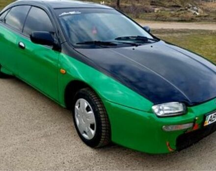 Зеленый Мазда 323, объемом двигателя 10 л и пробегом 100 тыс. км за 960 $, фото 2 на Automoto.ua