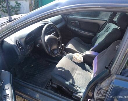 Зеленый Мазда 323, объемом двигателя 2 л и пробегом 250 тыс. км за 1440 $, фото 6 на Automoto.ua