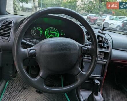 Зеленый Мазда 323, объемом двигателя 1.49 л и пробегом 290 тыс. км за 1799 $, фото 5 на Automoto.ua