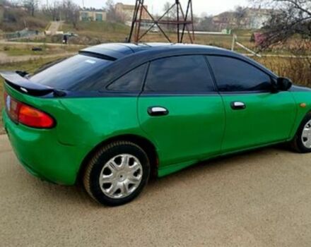 Зеленый Мазда 323, объемом двигателя 10 л и пробегом 100 тыс. км за 960 $, фото 3 на Automoto.ua