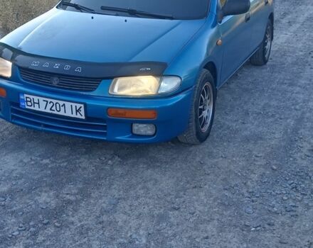 Зеленый Мазда 323, объемом двигателя 1.5 л и пробегом 300 тыс. км за 1903 $, фото 1 на Automoto.ua