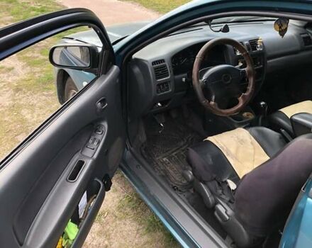 Зеленый Мазда 323, объемом двигателя 1.5 л и пробегом 290 тыс. км за 1500 $, фото 12 на Automoto.ua