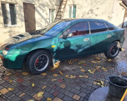 Зеленый Мазда 323, объемом двигателя 1.5 л и пробегом 270 тыс. км за 2199 $, фото 2 на Automoto.ua